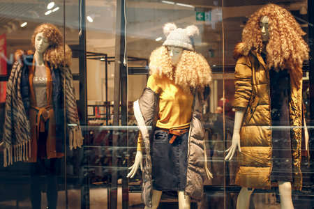 POLAND, BYDGOSZCZ - February 18, 2020: Funny hairy female mannequins show autumn winter spring clothes collection. Standing dummies in casual style in store windowのeditorial素材