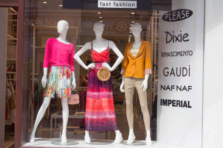 POLAND, TORUN - March 1, 2020: Three female mannequins in store window show spring summer clothing collection. White stylish dummiesのeditorial素材
