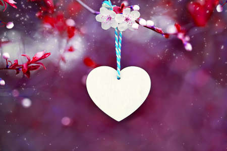 Valentine, mother's day. Heart on pink background of blooming sakura. Love symbolの写真素材