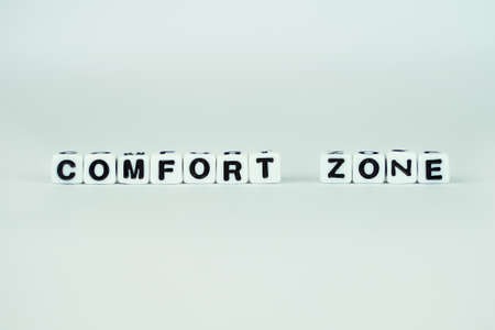 comfort zone. White cubes on glass blue isolated background. Concept of self-developmentの写真素材