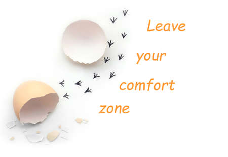 Leave your comfort zone. Footprints from an egg shell. First steps of a chick on a white isolated background. conceptの写真素材