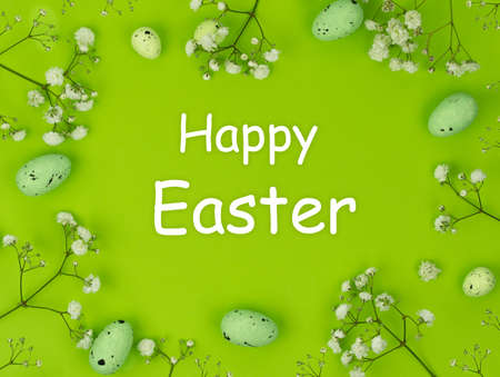 Happy Easter. Quail eggs in the nest against the background of fluffy feathers. Greeting card on the holidayの写真素材