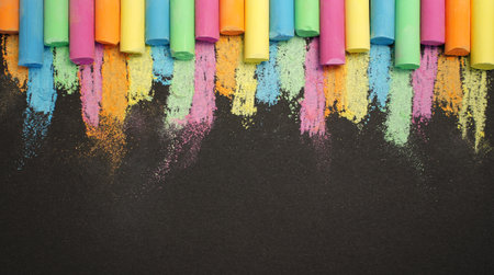 Multicolored chalk on black board. back to school. colored background. Bannerの写真素材