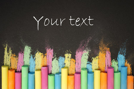 Multicolored chalk on black board. back to school. colored background. Bannerの写真素材