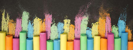 Multicolored chalk on black board. back to school. colored background. Bannerの写真素材
