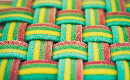 Marmalade wicker stripes. colorful rainbow background. Sugar gummy surface close upの写真素材
