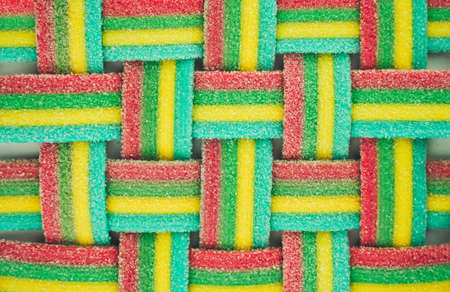 Marmalade wicker stripes. colorful rainbow background. Sugar gummy surface close upの写真素材