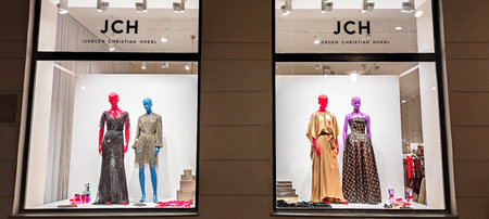 Austria, Vienna - January 9, 2023: JCH fashion store for an Austrian designer Juergen Christian Hoerl. Multi-colored LGBT mannequins in dresses in a shop windowのeditorial素材