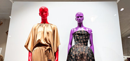 Austria, Vienna - January 9, 2023: JCH fashion store for an Austrian designer Juergen Christian Hoerl. Multi-colored LGBT mannequins in dresses in a shop windowのeditorial素材