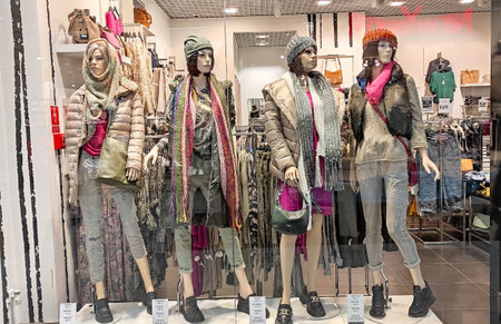 Poland, Bydgoszcz - September 29, 2022: Fashion store VENEZIA. Female mannequins demonstrate stylish winter clothes. Beautiful dolls in shop windowのeditorial素材