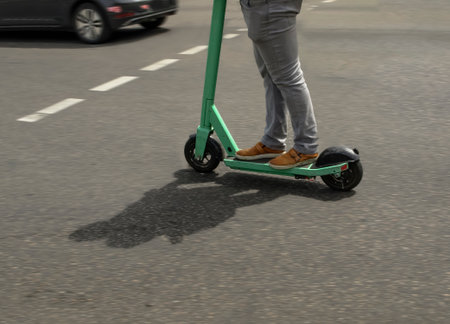 Blurred image of electric scooters on a city streetの写真素材