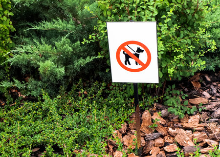 Sign with the prohibition of walking dogs on the lawnの写真素材