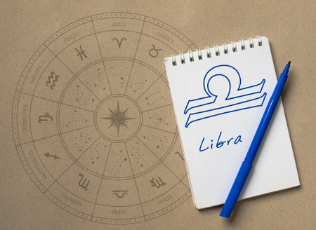Notepad with pen and drawing of zodiac sign Libraの写真素材