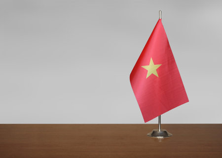 Vietnam table flag on gray blurred backgroundの写真素材