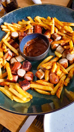 Self-made currywurst with friesの写真素材
