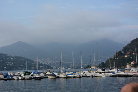 View of Lake Como, fog and boatsのeditorial素材
