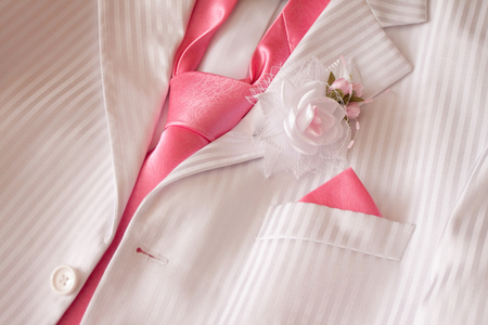 Wedding costume with pink necktie and buttonholeの写真素材