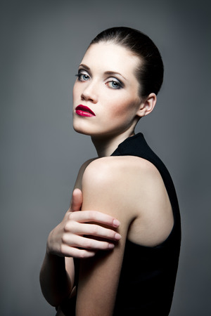 Portrait of young fashion woman with dark make-upの写真素材