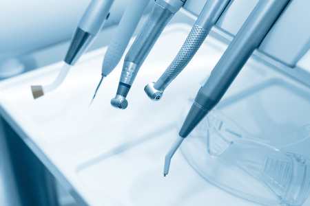 Tools of dentist in a dentist office. Blue tone.の写真素材