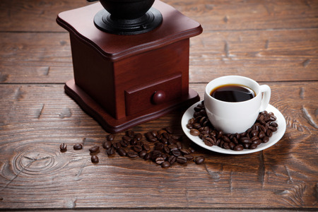 Cup of coffee with coffee beans and coffee mill. Still life with coffee.の写真素材