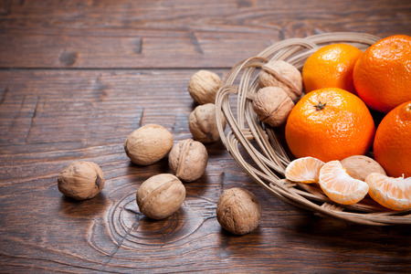 Tangerines on old wooden tableの写真素材
