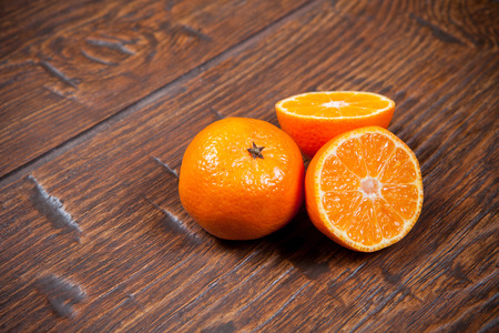 Tangerines on old wooden tableの写真素材