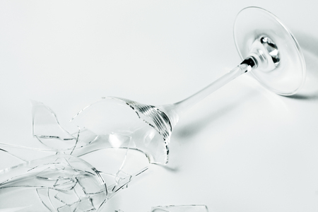 Broken wine glass on white backgroundの写真素材