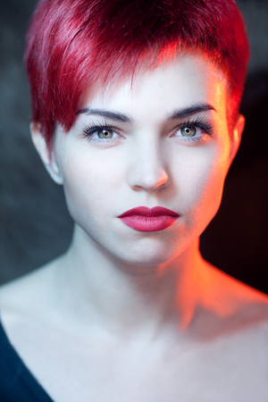 Beautiful young serious redhead womanの写真素材