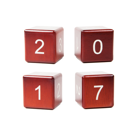 Wooden cubes with numbers isolated on white background. Concept new year 2017.の写真素材