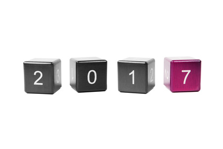 Wooden cubes with numbers isolated on white background. Concept new year 2017.