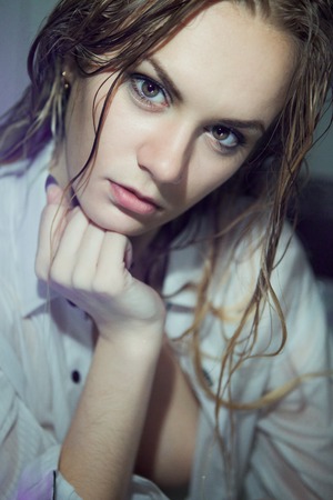 Portrait of a beautiful young girl with wet hairの写真素材
