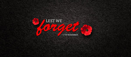 Lest We Forget 11th November inscription with Poppy flower on black textured background. Decorative flower for Remembrance Day. Memorial Day. Veterans day.の写真素材