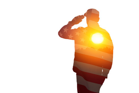 Silhouette of soldier with print of sunset and USA flag saluting isolated on white background. Greeting card for Veterans Day, Memorial Day, Independence Day. America celebration.の写真素材