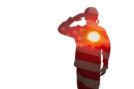 Silhouette of soldier with print of sunset and USA flag saluting isolated on white background. Greeting card for Veterans Day, Memorial Day, Independence Day. America celebration.の写真素材