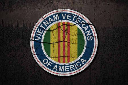 Symbol of the Vietnam Veterans of America on rusty iron background. Vietnam Veterans Day. General commemoration in the Armed Forces. Grunge style.の写真素材