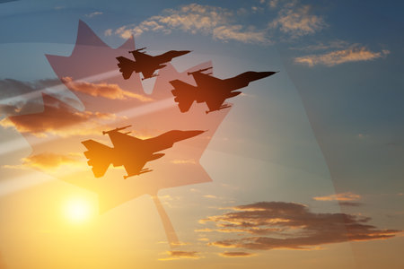 Air Force Day. Aircraft silhouettes on background of sunset with a transparent Canadian flag. Since 2006, the Royal Canadian Air Force has celebrated Air Force Day on 4 June.の写真素材