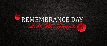 Remembrance Day Lest We Forget inscription with Poppy flower on black textured background. Decorative flower for Remembrance Day. Memorial Day. Veterans day.の写真素材