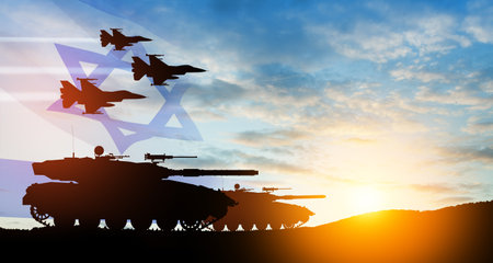 Silhouettes of army tanks and fight planes on background of sunset with a transparent waving Israel flag. Military machinery. Independence day.の写真素材