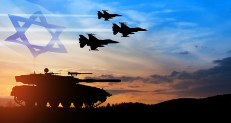 Silhouettes of army tank and fight planes on background of sunset with a transparent waving Israel flag. Military machinery. Independence day.の写真素材