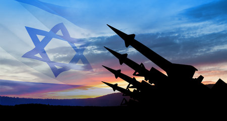 The missiles are aimed at the sky at sunset with Israel flag. Nuclear bomb, chemical weapons, missile defense, a system of salvo fire.の写真素材