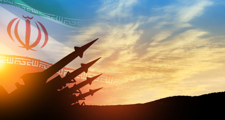The missiles are aimed at the sky at sunset with Iran flag. Bomb, chemical weapons, missile defense, a system of salvo fire.の写真素材