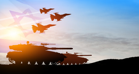 Silhouettes of army tanks and fight planes on background of sunset with a transparent waving Israel flag. Military machinery. Independence day.の写真素材