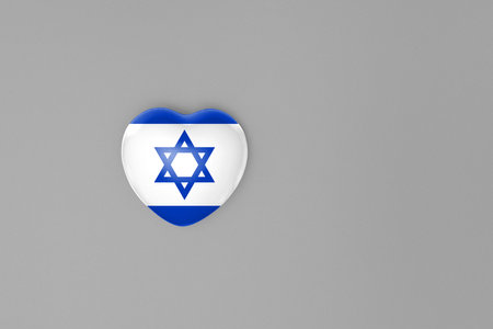 Top view or flat lay of heart with print of Israel flag on gray background with copy space.の写真素材