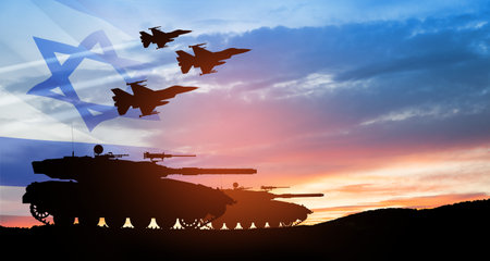 Silhouettes of army tanks and fight planes on background of sunset with a transparent waving Israel flag. Military machinery. Independence day.の写真素材