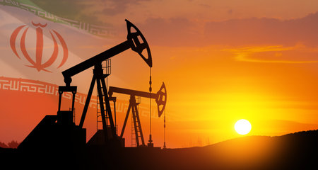 Oil drilling derricks at desert oilfield with Iran flag. The change in oil prices caused by the war. Oil prices are rising because of the global crisis. Crude oil production from the ground.の写真素材