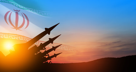 The missiles are aimed at the sky at sunset with Iran flag. Bomb, chemical weapons, missile defense, a system of salvo fire.の写真素材