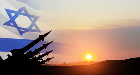 The missiles are aimed at the sky at sunset with Israel flag. Nuclear bomb, chemical weapons, missile defense, a system of salvo fire.の写真素材