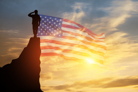 USA army soldier saluting on a background of sunset or sunrise and USA flag. Greeting card for Veterans Day, Memorial Day, Independence Day. America celebration. 3D-rendering.の写真素材