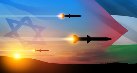 Confrontation between Palestine and Israel. Fired missiles fly to the target. Missiles at the sky at sunset with Palestine flag and Israel flag. Missile defense, a system of salvo fire.の写真素材