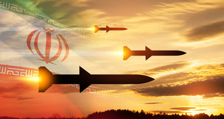 Fired missiles fly to the target. Missiles at the sky at sunset with Iran flag. Missile defense, a system of salvo fire.の写真素材